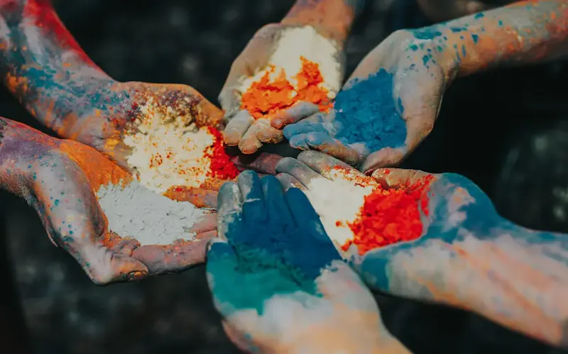 Image of Rishi's in Slate And Grain Brasserie & Bar color powder on palms | Photo by Sandra Seitamaa, on https://unsplash.com/@seitamaaphotography?utm_source=centralapp&utm_medium=referral
