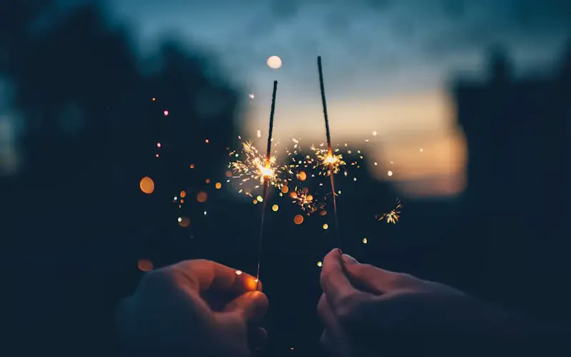 Image of WOK IN person holding fire cracker shallow focus photography | Photo by Ian Schneider, on https://unsplash.com/@goian?utm_source=centralapp&utm_medium=referral