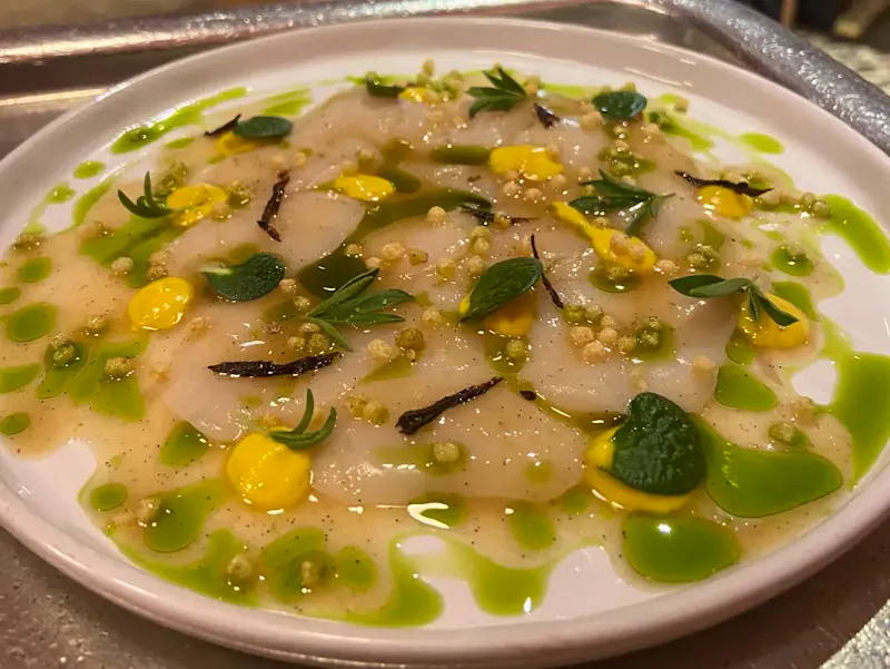 Scallop season is officially open!  Served as carpaccio by chef Lucas Felzine and available à la carte now.
