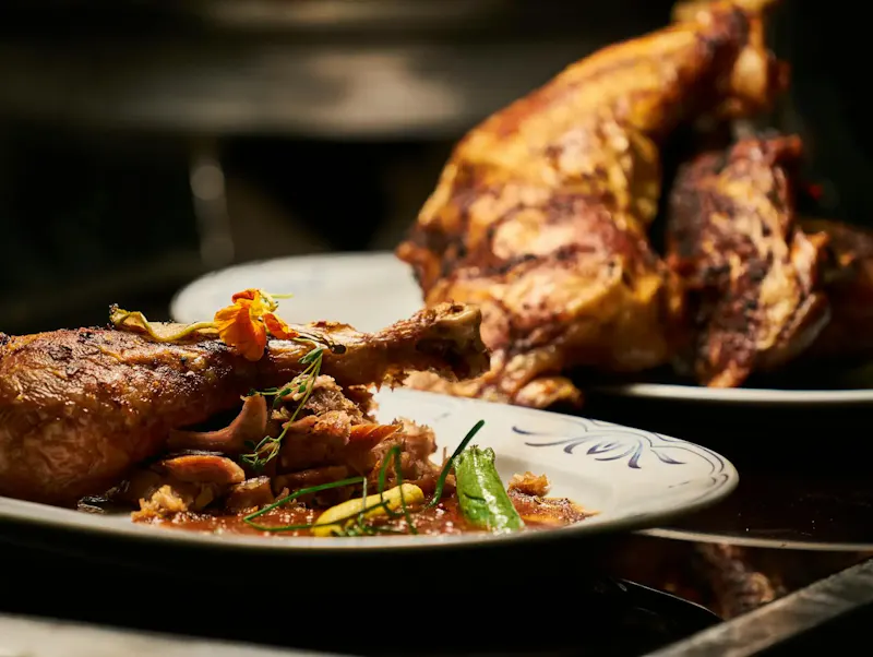 Image of Chapa tu Pollo Close-up of a deliciously roasted chicken dish served with garnish, highlighting fine cuisine. | Photo by Engin Akyurt, on https://www.pexels.com/@enginakyurt?utm_source=centralapp&utm_medium=referral