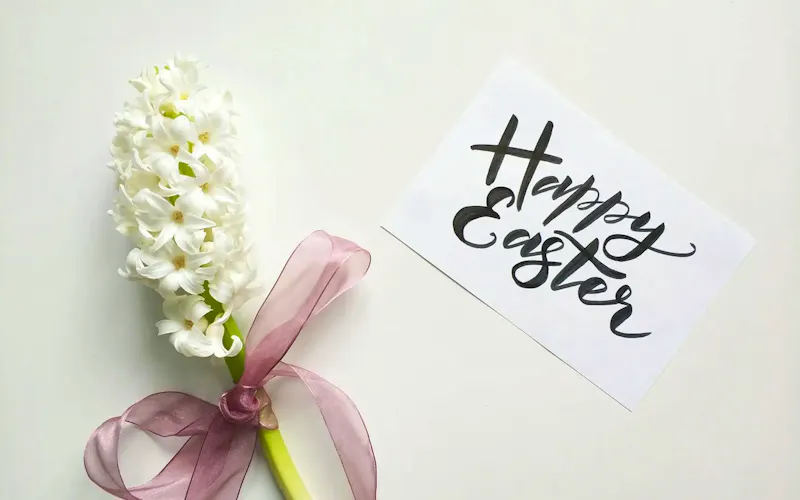White hyacinth with ribbon and Happy Easter card on a white background. | Photo by Alena Koval, on https://www.pexels.com/@alena-koval-233944?utm_source=CentralApp&utm_medium=referral