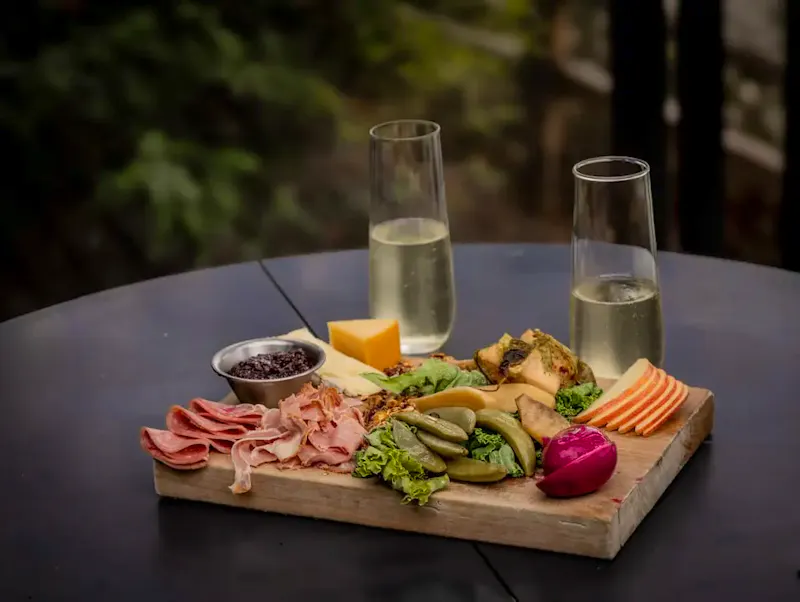 Charcuterie board with meats, cheeses, and fruit | Photo by Sara Kozak, on https://unsplash.com/@sara_kozak?utm_source=CentralApp&utm_medium=referral